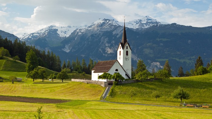 Switzerland-Alps-mountains-grass-trees-church-sky-clouds_1920x1080